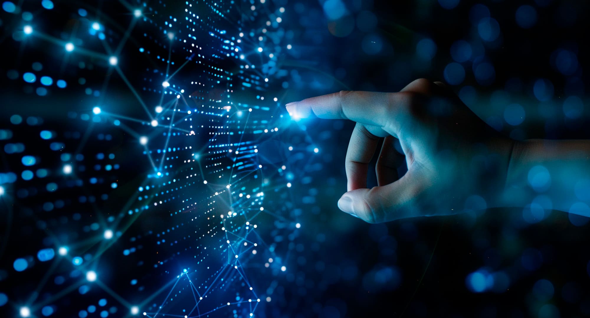 Mano interactuando con una red digital simulada, representando la inteligencia artificial aplicada al sector de las telecomunicaciones